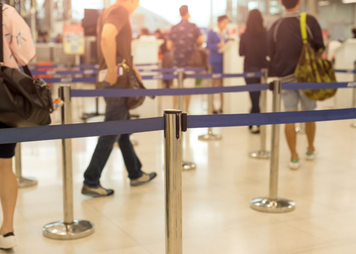 Passengers waiting in line at airport