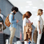 People waiting in security line at airport