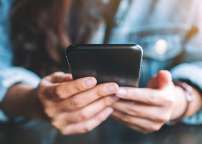 Close up of person holding a smartphone