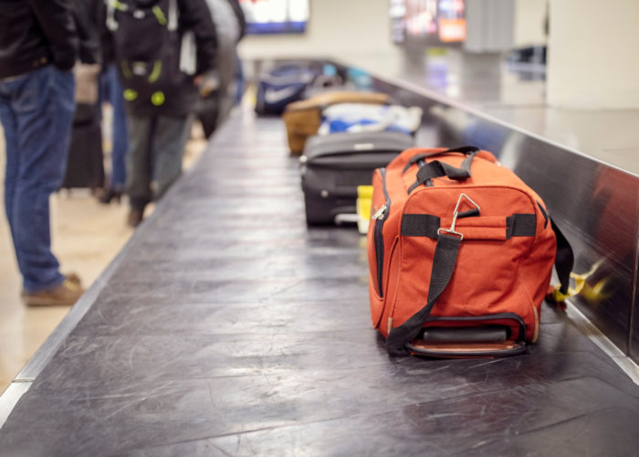 Luggage on baggage carousel at airport