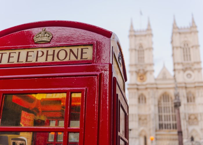 UK, London, Phone booth with Westminster Abbey behind DO NOT USE