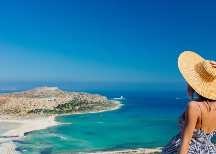 girl in hat on balos greece.