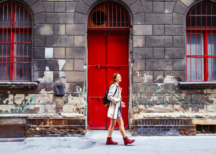 tylish woman on the Background of European City Street and one of the historical architectural buildings of Budapest, Hungary