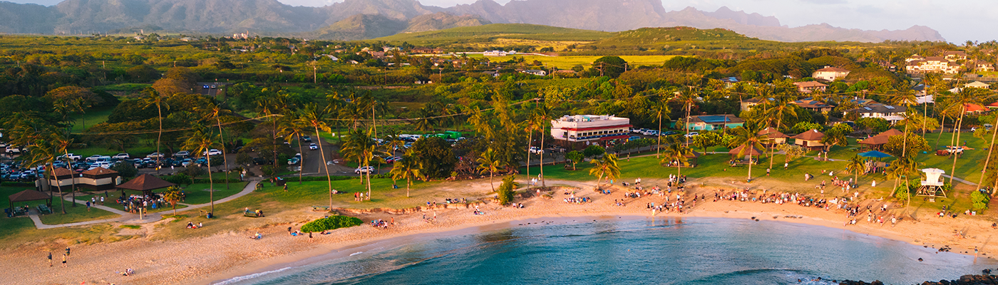 Aerial of Poipu beach during sunset in Kauai Hawaii USA